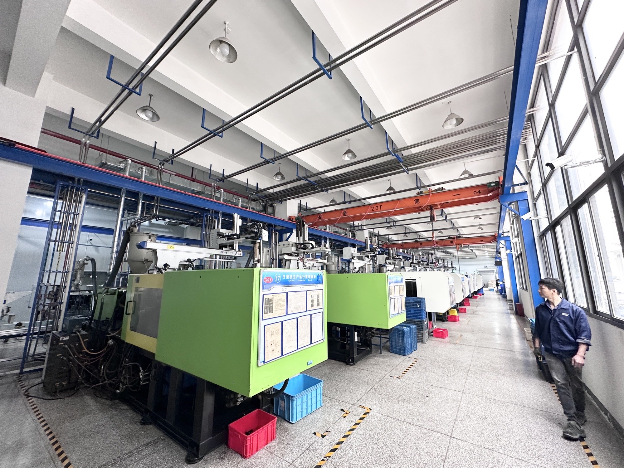 Hongye injection molding workshop with rows of molding machines in Xiamen, China