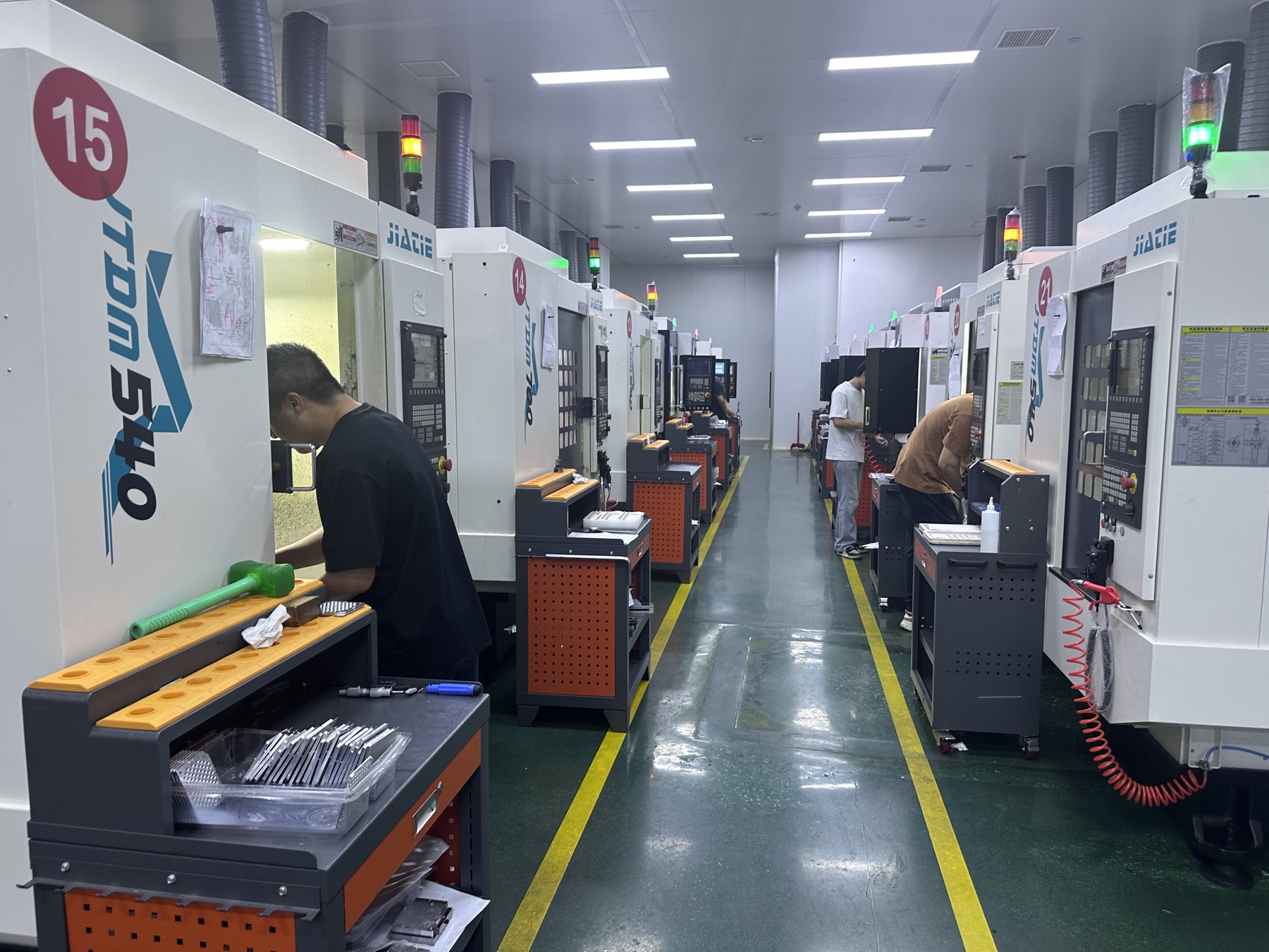 Rows of CNC machining centers on the Hongye factory floor in Xiamen