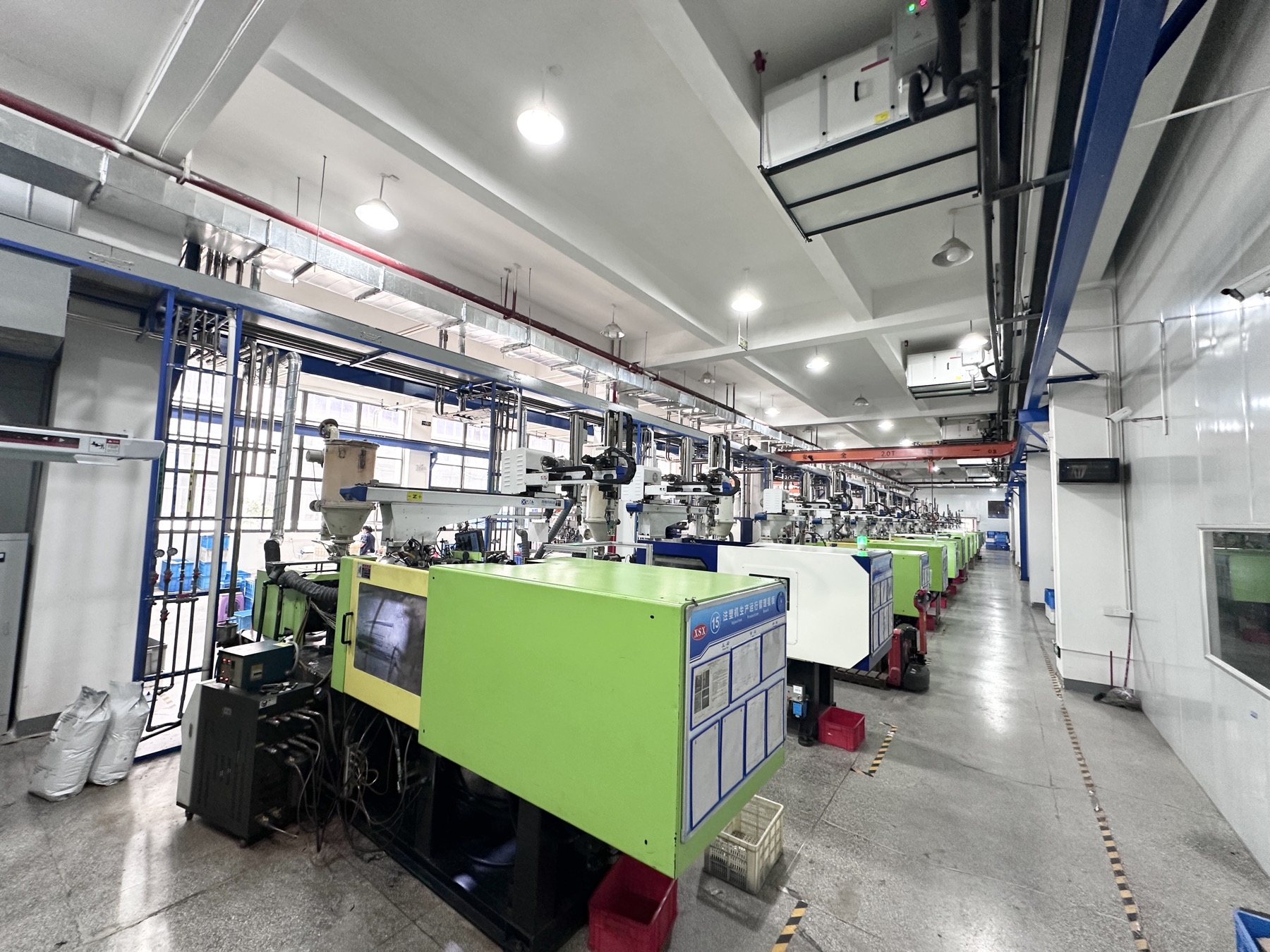 Row of automated injection molding machines at the Hongye production facility